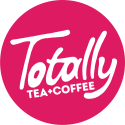 Pink circle with white text saying Totally Tea+Coffee